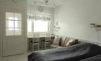 Bed by the window in Leviloma 21 m² apartment, Levi