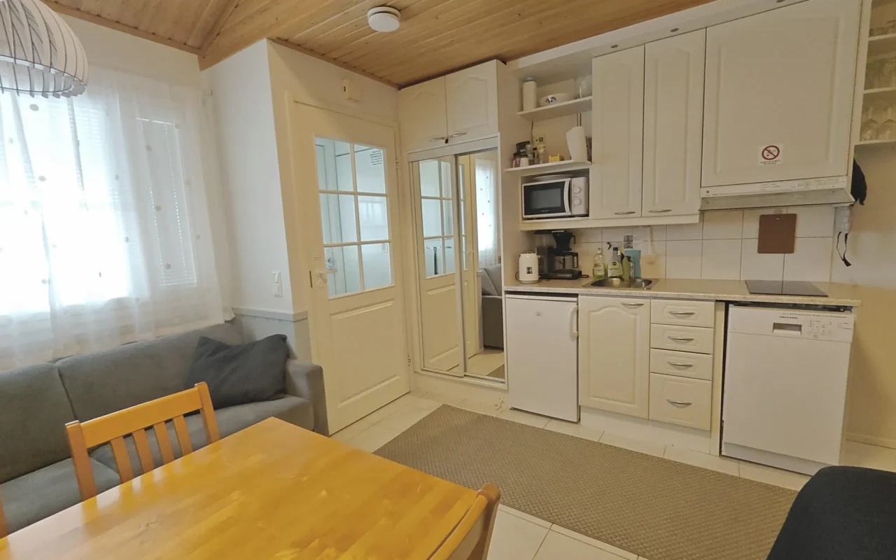 Kitchenette and sofa in Leviloma 27 m² B apartment, Levi