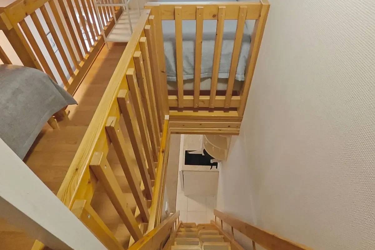 Loft stairs seen from above in Leviloma 27 m² B apartment, Levi