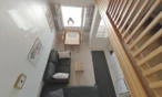Living area seen from the loft in Leviloma 27 m² C apartment, Levi