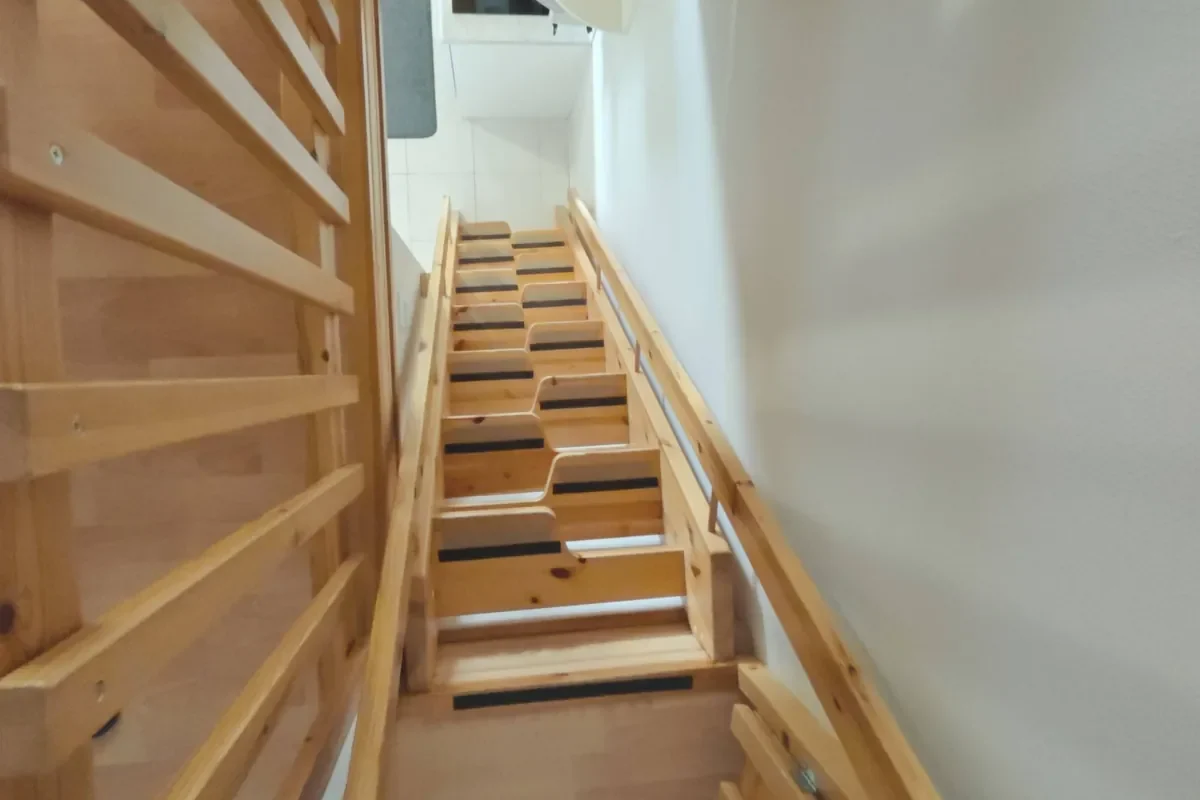 Loft stairs seen from above in Leviloma 27 m² C apartment, Levi